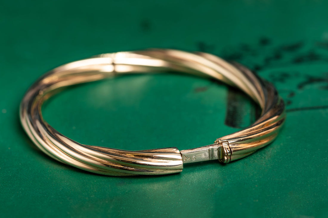 9ct yellow gold twisted hinged bangle