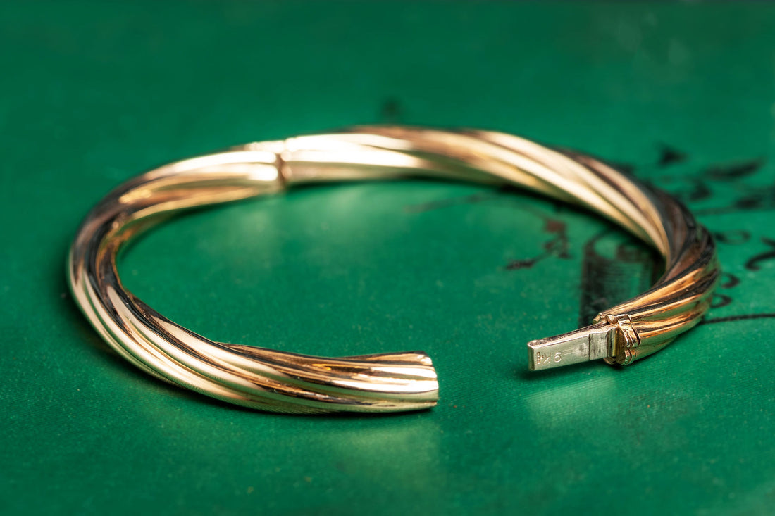 9ct yellow gold twisted hinged bangle