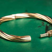9ct yellow gold twisted hinged bangle