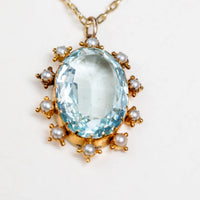 Oval Aquamarine and Pearl surround pendant