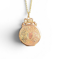 9ct round locket with bow detailing