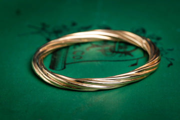 9ct yellow gold twisted hinged bangle