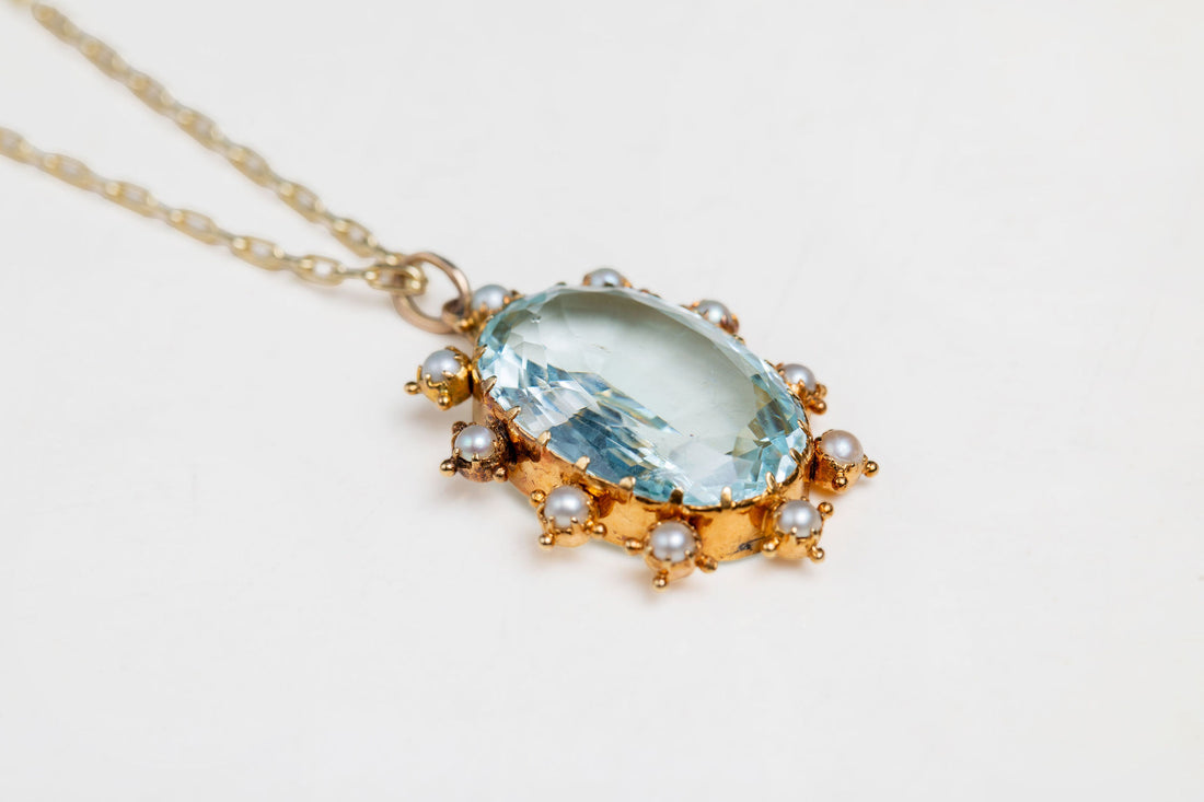 Oval Aquamarine and Pearl surround pendant