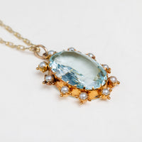 Oval Aquamarine and Pearl surround pendant