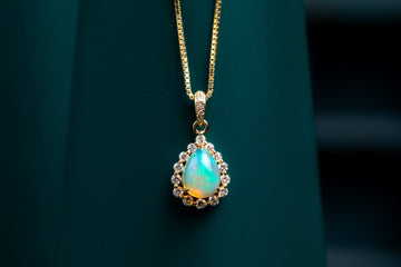 9ct yellow gold opal and diamond pendant