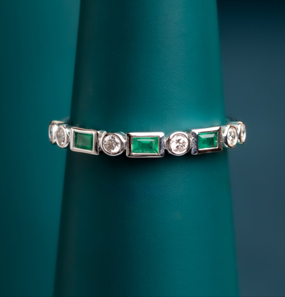 Emerald and diamond eternity ring