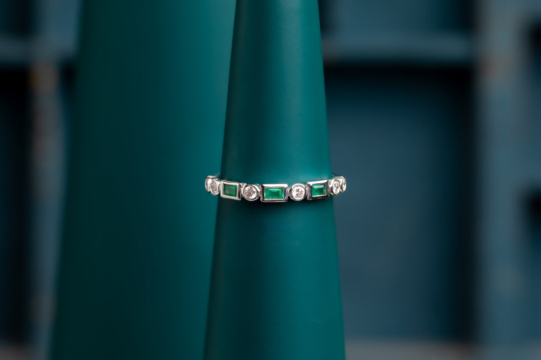 Emerald and diamond eternity ring