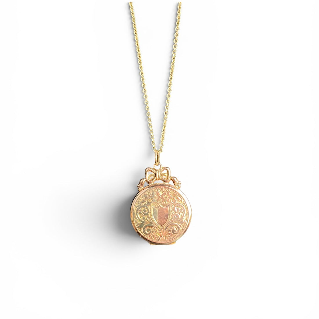 9ct round locket with bow detailing